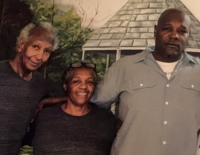 Clifford (far right) with his mother, Emily, and stepfather, Enoch Wright Jr., at Elayn Hunt.